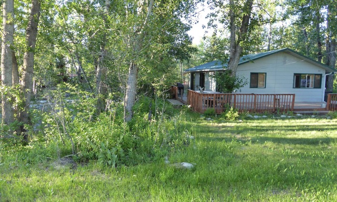 Red Lodge Cabin | Cozy Getaway in Town! Enjoy Rock Creek Flowing Just Steps from Wrap Round Deck