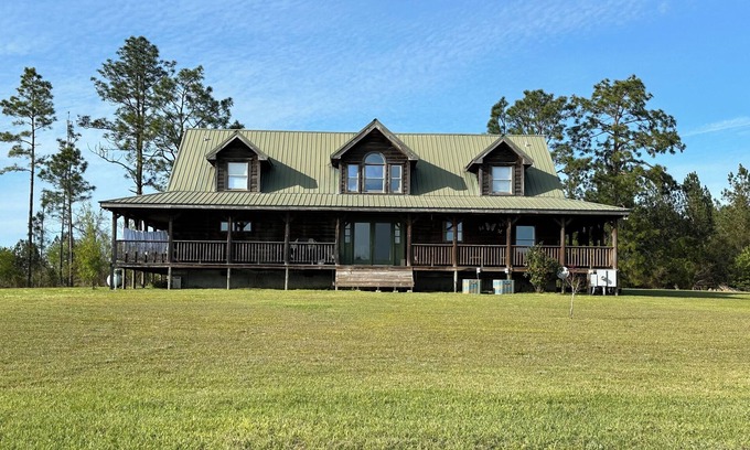 Toombs County Cabin | Kennedy Family Cabin- a large log cabin in a rural, farming community