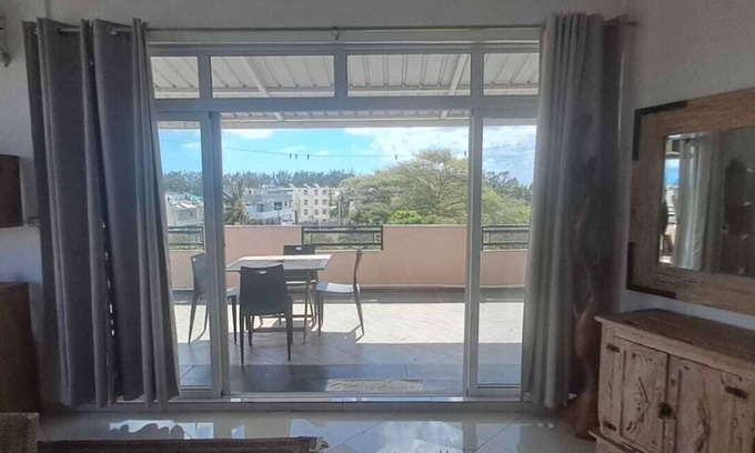 Flic-en-Flac Apartment | Loft in the center of Flic en Flac with corner terrace. 400m from the beachn