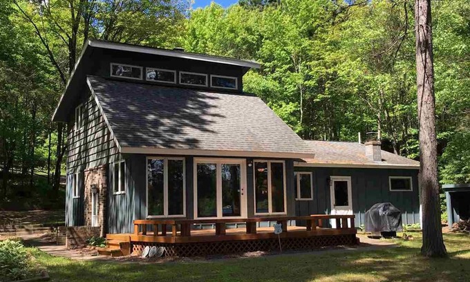 Solon Springs Cabin | Northwoods lake home with gentle slope to clear lake with sandy beach