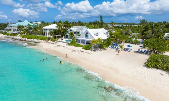 West Bay Condo | Private 7 Mile Beach Beach Club. Ocean views from Roof Terrace and Pool Pavilion