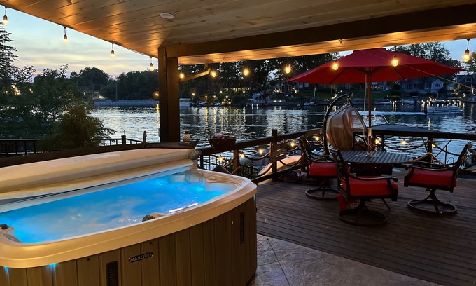 Portage Lakes Cottage | SLICE OF HEAVEN lake front cottage with HOTTUB, fire pit, kayaks & Dog friendly!