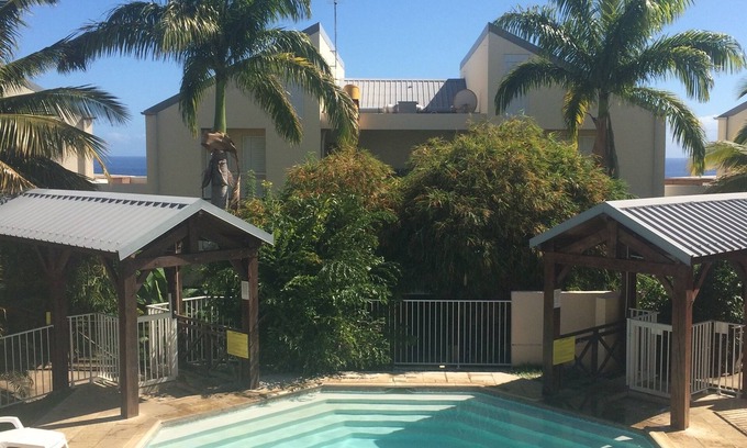 Carosse Hotel | T2 luxury Saint Gilles baths with beautiful garden and pool view me