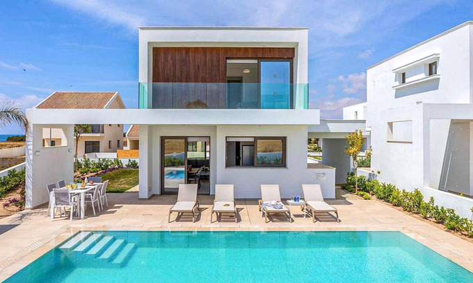 Softades House | Welcome to this stunning, modern villa, which sits within an exclusive gated complex surrounded by f