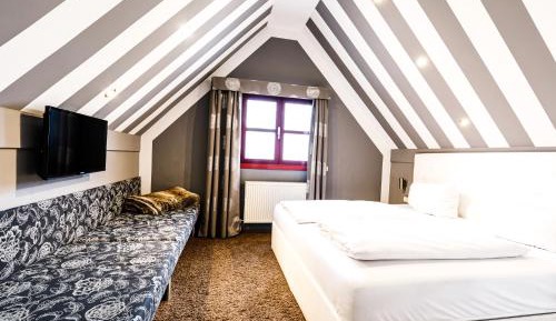 Quadruple Room (3 Adults + 1 Child)