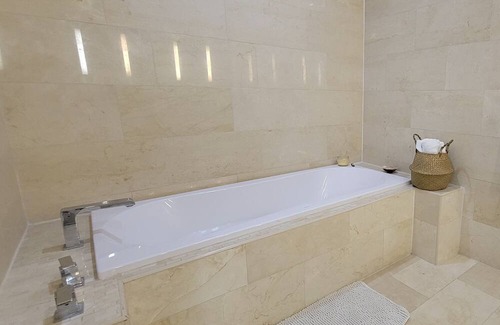 Bahamia West Condo | Gated Lux family size condo near beach w/boat dock, working station, pool, canal