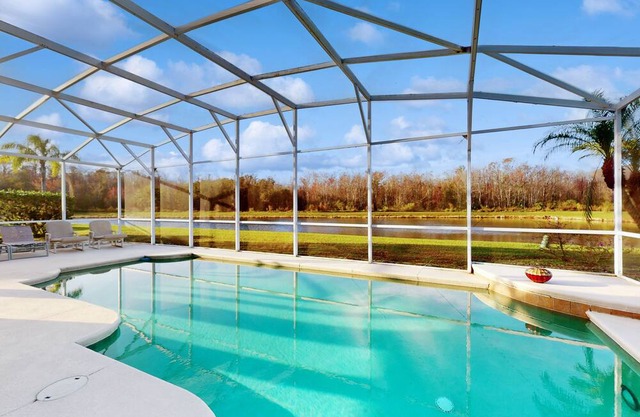 Idyllic lakefront retreat with private pool, patio, & games - near parks & golf