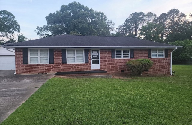 Charming brick ranch on 1.28 acres near downtown Covington, GA,
